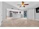 Spacious living room with tile floors, ceiling fan, and view of the kitchen at 8620 Cremona Dr, Las Vegas, NV 89117