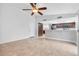 Spacious living room with tile floors and direct access to the kitchen at 8620 Cremona Dr, Las Vegas, NV 89117