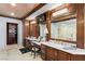 Beautiful bathroom with a vanity, dual sinks, and a glass-enclosed shower, complemented by elegant wood trim at 9103 Alta Dr # 602, Las Vegas, NV 89145
