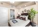 Stylish bedroom with a sleek design, featuring a cozy bed and a private door to a bathroom at 9103 Alta Dr # 602, Las Vegas, NV 89145