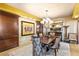 Formal dining room with chandelier, decorative wall paper, and custom wall trim at 9103 Alta Dr # 602, Las Vegas, NV 89145