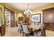 Formal dining room features a chandelier, seating for six, and decorative walls at 9103 Alta Dr # 602, Las Vegas, NV 89145