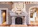 Ornate fireplace featuring sculpted figures, arched detailing, and custom ironwork at 9103 Alta Dr # 602, Las Vegas, NV 89145