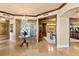 Elegant foyer with decorative lighting, travertine floors, and custom millwork at 9103 Alta Dr # 602, Las Vegas, NV 89145