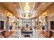 Grand foyer with an intricate floral-patterned floor, bespoke statues, and opulent chandeliers at 9103 Alta Dr # 602, Las Vegas, NV 89145