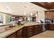Gourmet kitchen with custom cabinetry, granite countertops, and designer lighting at 9103 Alta Dr # 602, Las Vegas, NV 89145