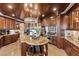 Gourmet kitchen boasting custom wood cabinetry, granite countertops, stainless steel appliances, and a center island at 9103 Alta Dr # 602, Las Vegas, NV 89145