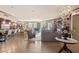 Expansive living room features a decorative chandelier, comfortable seating, piano, and floor-to-ceiling windows at 9103 Alta Dr # 602, Las Vegas, NV 89145