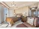 Lavish bedroom featuring a decorative chandelier, patterned bedding, and private balcony access at 9103 Alta Dr # 602, Las Vegas, NV 89145