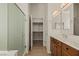 Well-lit bathroom featuring a walk-in closet and glass shower at 950 Overland Trl, Mesquite, NV 89034