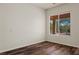 Bright bedroom features hardwood floors and a window view of the backyard oasis at 950 Overland Trl, Mesquite, NV 89034