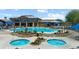 Outdoor community pool and spas surrounded by desert landscaping and comfortable seating for relaxation at 950 Overland Trl, Mesquite, NV 89034