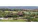 Expansive golf course community view with clubhouse, ponds, and desert landscaping at 950 Overland Trl, Mesquite, NV 89034