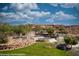 Scenic view of the community's tiered water feature with lush greenery and clear blue skies at 950 Overland Trl, Mesquite, NV 89034