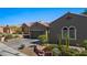 Attractive home exterior with desert landscaping and a three-car garage at 950 Overland Trl, Mesquite, NV 89034
