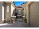 Inviting front entrance with a decorative gate, desert landscaping, and a charming walkway at 950 Overland Trl, Mesquite, NV 89034
