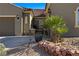 Charming front entrance with desert landscaping and a walkway gate at 950 Overland Trl, Mesquite, NV 89034
