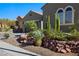 Landscaped front yard with decorative rocks, cacti, and desert plants enhance curb appeal at 950 Overland Trl, Mesquite, NV 89034