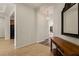 Hallway featuring tiled flooring, chandelier lighting, and archways connecting living areas, and modern appliances at 950 Overland Trl, Mesquite, NV 89034