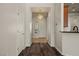 Inviting hallway with wood-look flooring and a charming chandelier at 950 Overland Trl, Mesquite, NV 89034