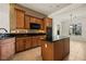 Kitchen features granite countertops, wooden cabinets, and stainless appliances at 950 Overland Trl, Mesquite, NV 89034