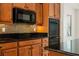 Modern kitchen with granite counters, mosaic backsplash, and stainless appliances at 950 Overland Trl, Mesquite, NV 89034