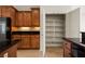View of the kitchen with an open pantry featuring wooden shelves at 950 Overland Trl, Mesquite, NV 89034