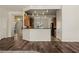Open concept kitchen with stylish lighting, wood cabinets, and a breakfast bar at 950 Overland Trl, Mesquite, NV 89034