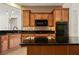Kitchen features wooden cabinets, granite countertops, and stainless appliances at 950 Overland Trl, Mesquite, NV 89034