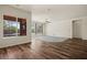 Open-concept living room with hardwood floors, ceiling fan, and view of the backyard at 950 Overland Trl, Mesquite, NV 89034