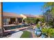 Beautiful backyard showcasing a sparkling pool, serene water features, and colorful foliage at 950 Overland Trl, Mesquite, NV 89034