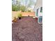 Mulched backyard with potted plants, offering a tranquil outdoor space at 9746 Brooks Lake Ave, Las Vegas, NV 89148