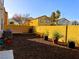 A mulched backyard with privacy wall and landscaping at 9746 Brooks Lake Ave, Las Vegas, NV 89148