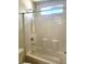 Bathroom with shower and bath tub combination and a small window at 9746 Brooks Lake Ave, Las Vegas, NV 89148