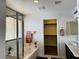 Bathroom featuring a soaking tub, glass enclosed shower, and double sink vanity at 9746 Brooks Lake Ave, Las Vegas, NV 89148