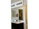 Bright bathroom vanity with double sinks, a large mirror, and modern fixtures at 9746 Brooks Lake Ave, Las Vegas, NV 89148