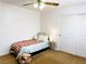 Bedroom featuring neutral carpet, a ceiling fan, and slider closet at 9746 Brooks Lake Ave, Las Vegas, NV 89148