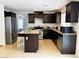 Charming kitchen featuring stainless steel appliances, granite countertops, and a center island at 9746 Brooks Lake Ave, Las Vegas, NV 89148