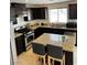 Charming kitchen featuring stainless steel appliances, granite countertops, and a center island at 9746 Brooks Lake Ave, Las Vegas, NV 89148