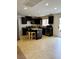 Charming kitchen featuring stainless steel appliances, granite countertops, and a center island at 9746 Brooks Lake Ave, Las Vegas, NV 89148
