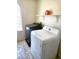 Laundry room featuring side-by-side washer and dryer with overhead storage at 9746 Brooks Lake Ave, Las Vegas, NV 89148