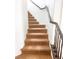 Carpeted staircase with dark railing leading to the upper level of the home at 9746 Brooks Lake Ave, Las Vegas, NV 89148