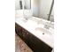 Double sink vanity with decorative cabinets and large mirror at 9746 Brooks Lake Ave, Las Vegas, NV 89148