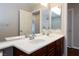 Bathroom with double sink vanity and spacious mirrors at 1009 Ancient Timber Ave, Henderson, NV 89052