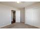 A clean, carpeted bedroom with closet space and an open doorway at 1009 Ancient Timber Ave, Henderson, NV 89052
