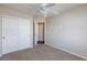 Carpeted bedroom with closet and open doorway to the rest of the home at 1009 Ancient Timber Ave, Henderson, NV 89052