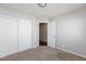Bright carpeted bedroom with closet and open doorway at 1009 Ancient Timber Ave, Henderson, NV 89052