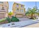 Charming three-story home with a two-car garage and beautiful landscaping, providing curb appeal at 1009 Ancient Timber Ave, Henderson, NV 89052