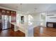Beautiful kitchen with granite countertop island, stainless steel appliances, and wood floors at 1009 Ancient Timber Ave, Henderson, NV 89052
