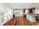Kitchen with hardwood floors and view into living space at 1009 Ancient Timber Ave, Henderson, NV 89052